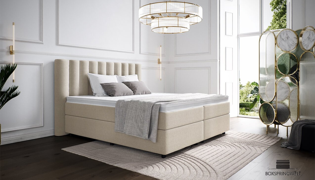 Boxspringbett Diana in Bezug Mine Beige. Kopfteil mit Seitenüberstand. Runde Füße in Schwarz